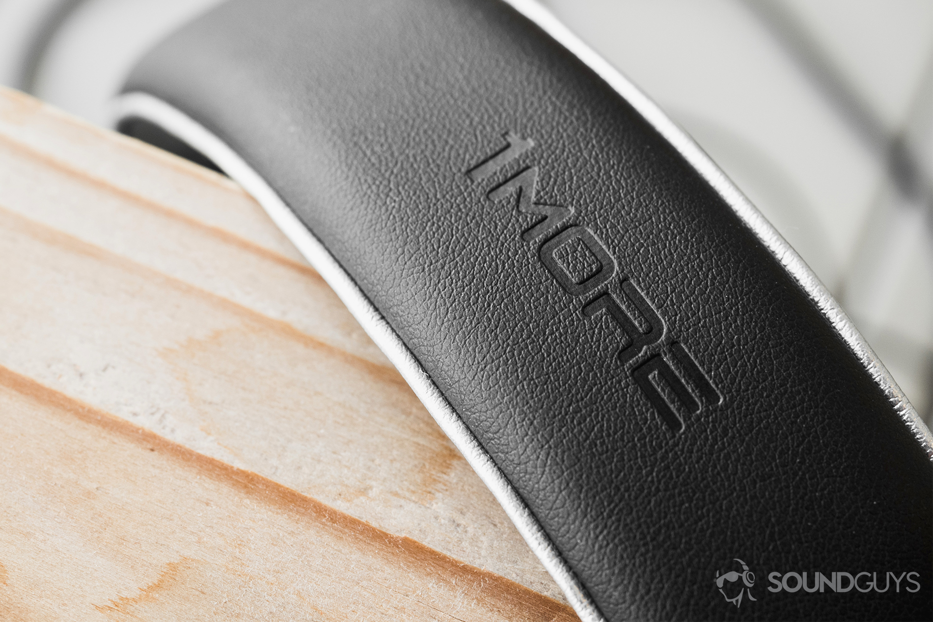 1More_Triple-Driver Over-Ear_LK_3 1More Triple-Driver Over-Ear review: A close-up of the headband to display the embossed 1More logo on the leather headband.