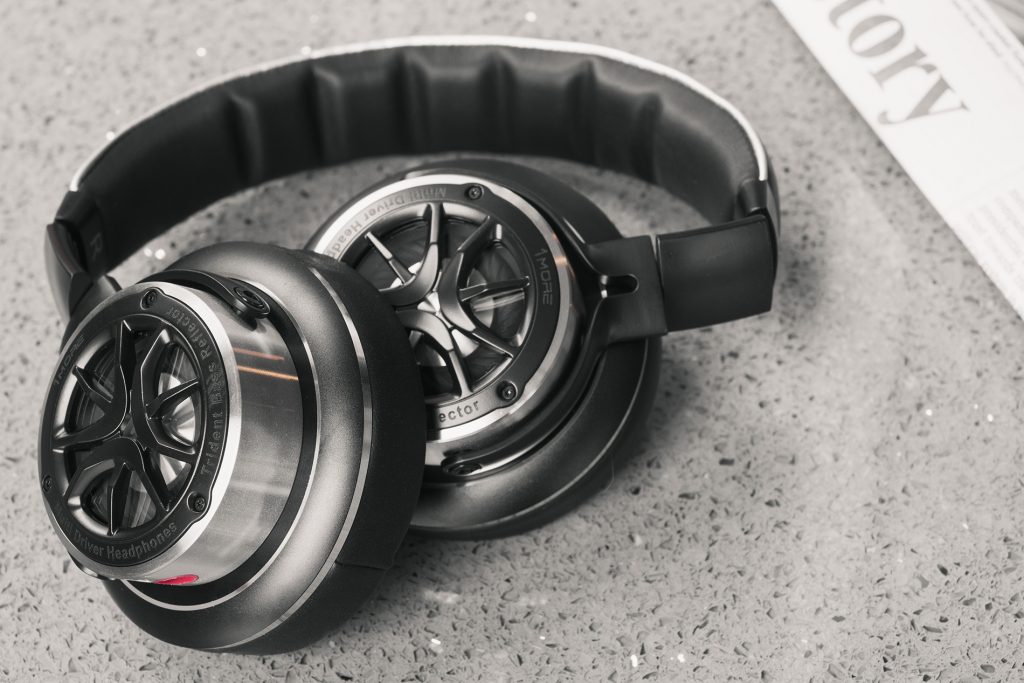 1More Triple-Driver Over-Ear review: The headphones with both hinges bent and the right ear cup overlapping the left. 
