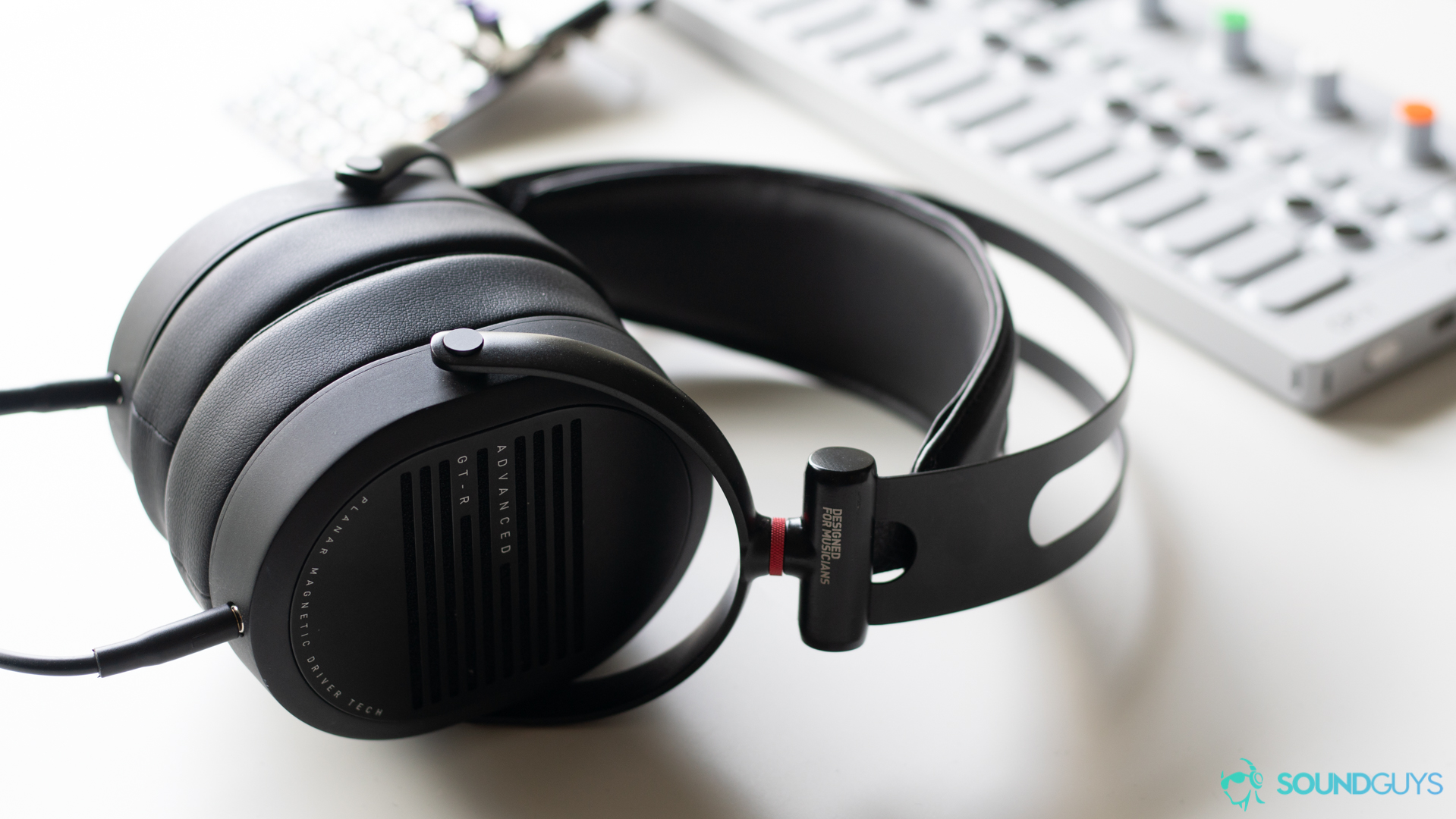ADV.Sound GT-R review: The GT-R headphones on a white desk.