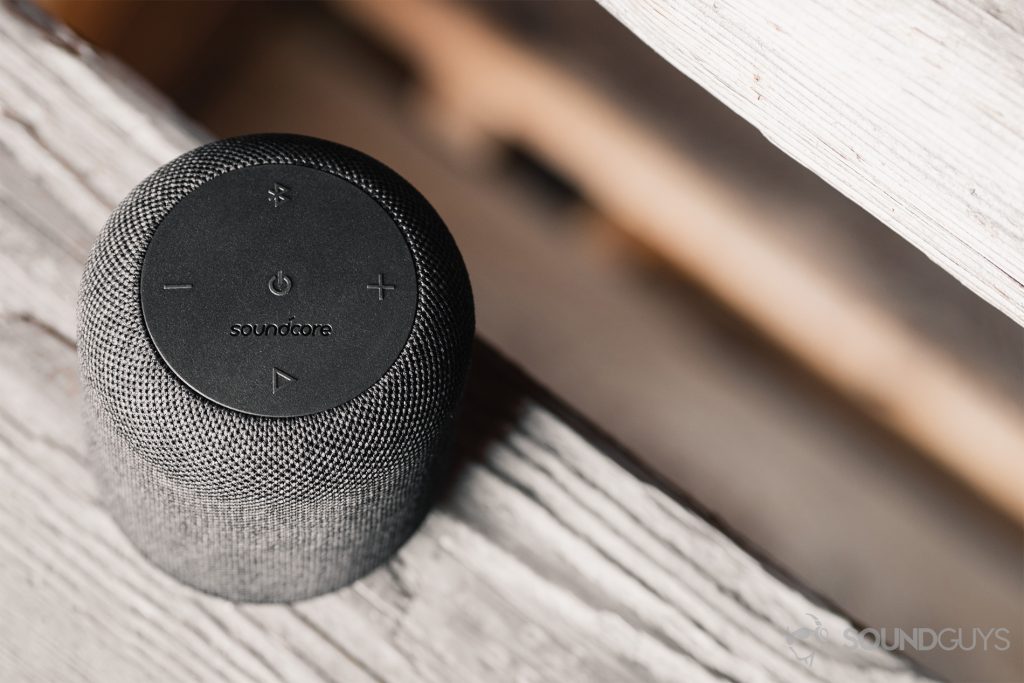 Anker Soundcore Motion Q review: An angled, downward shot of the speaker on a set of wooden, dilapidated stairs.