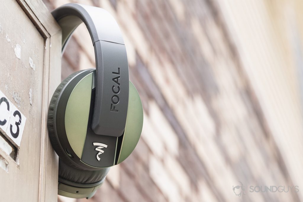 Focal Listen Wireless review: The headphones resting on an apartment mailbox against an out-of-focus brick background.