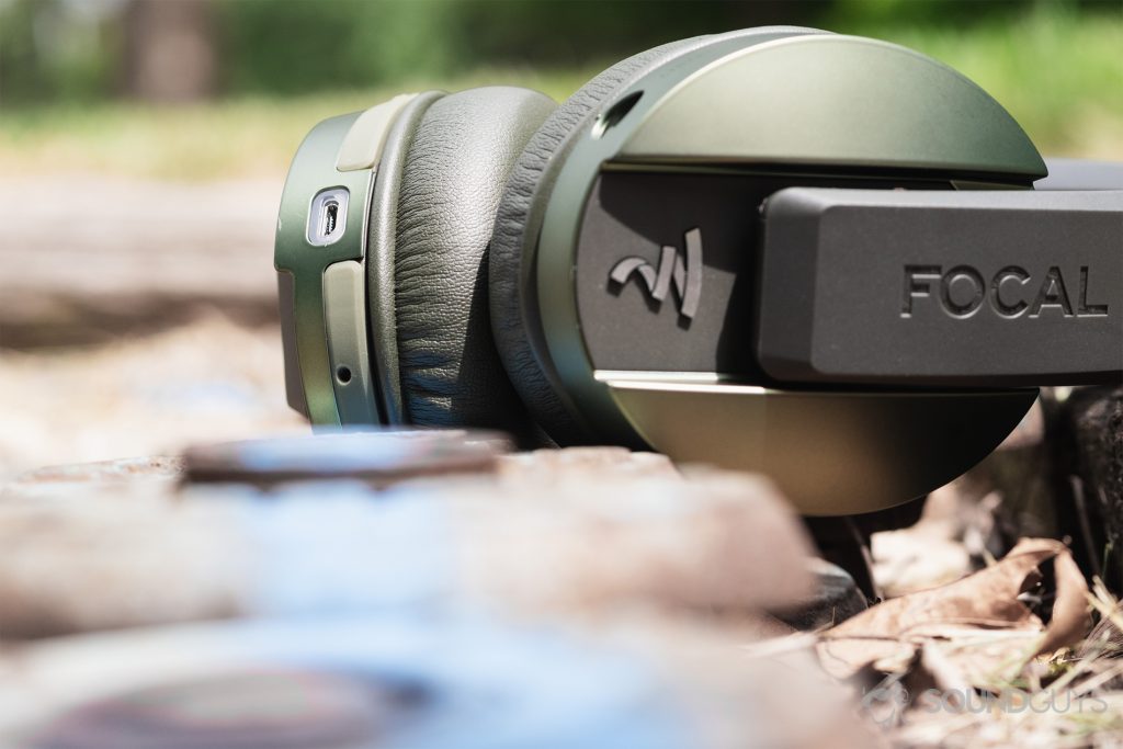 Focal Listen Wireless review: An image of the headphones (olive) with the micro-USB input in focus.