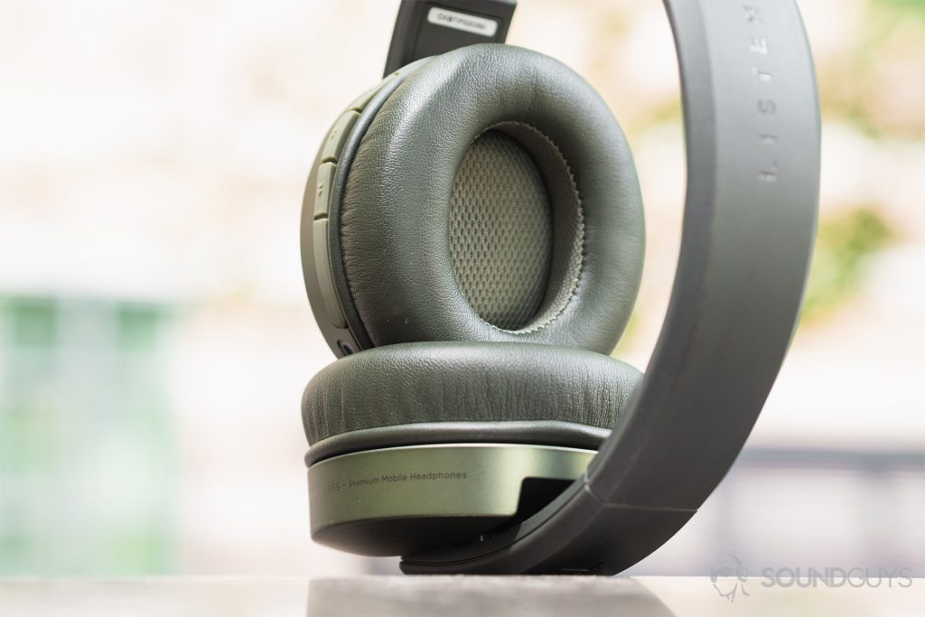 Focal Listen Wireless review: A straight shot of the headphones standing on one ear cup. The ear cup that's bent at the hing is visible (interior) to show the plush shape of the cushion.