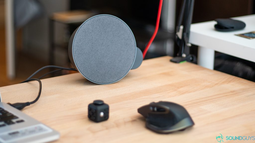 The MX Sound speaker next to a mouse also made by Logitech.