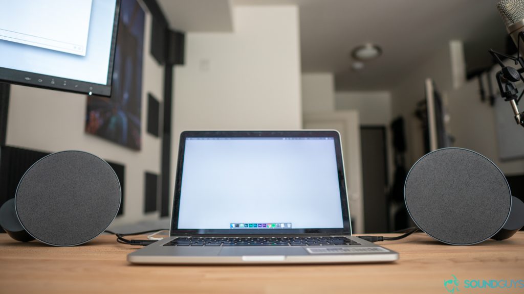 The MX Sound next to a laptop on the desk.