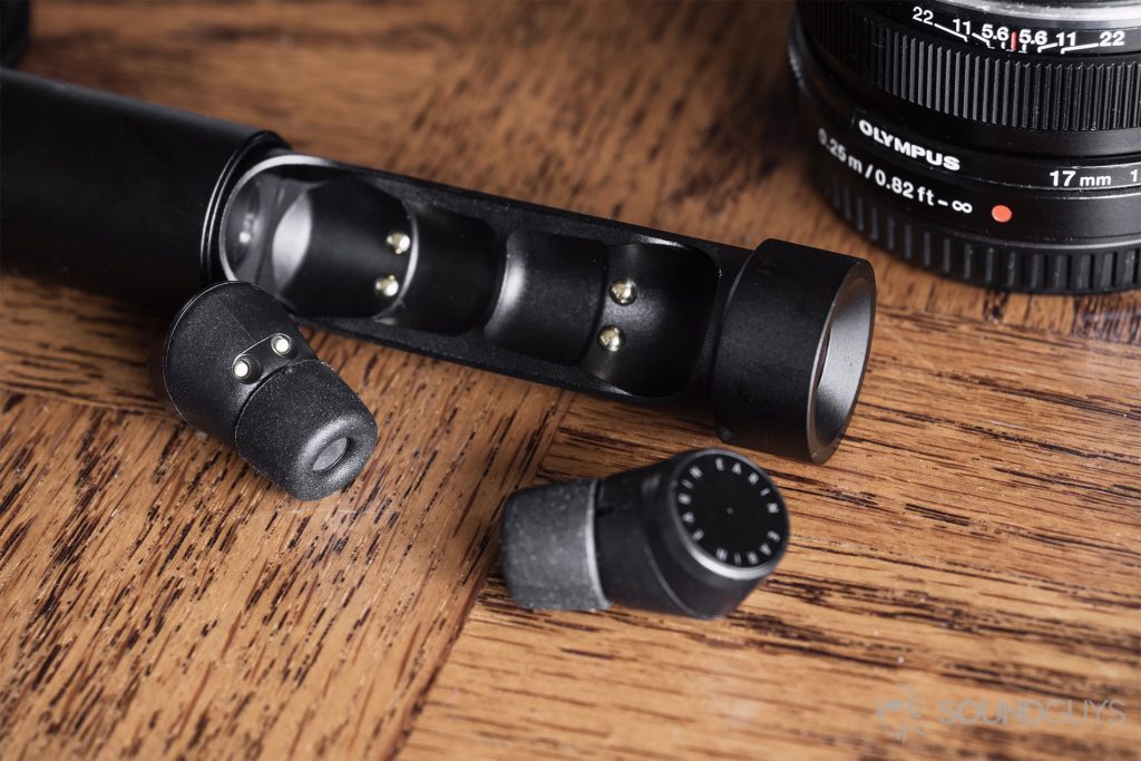 Earin M-2 review: A close-up of the open tube to show charging connections and the earbuds.