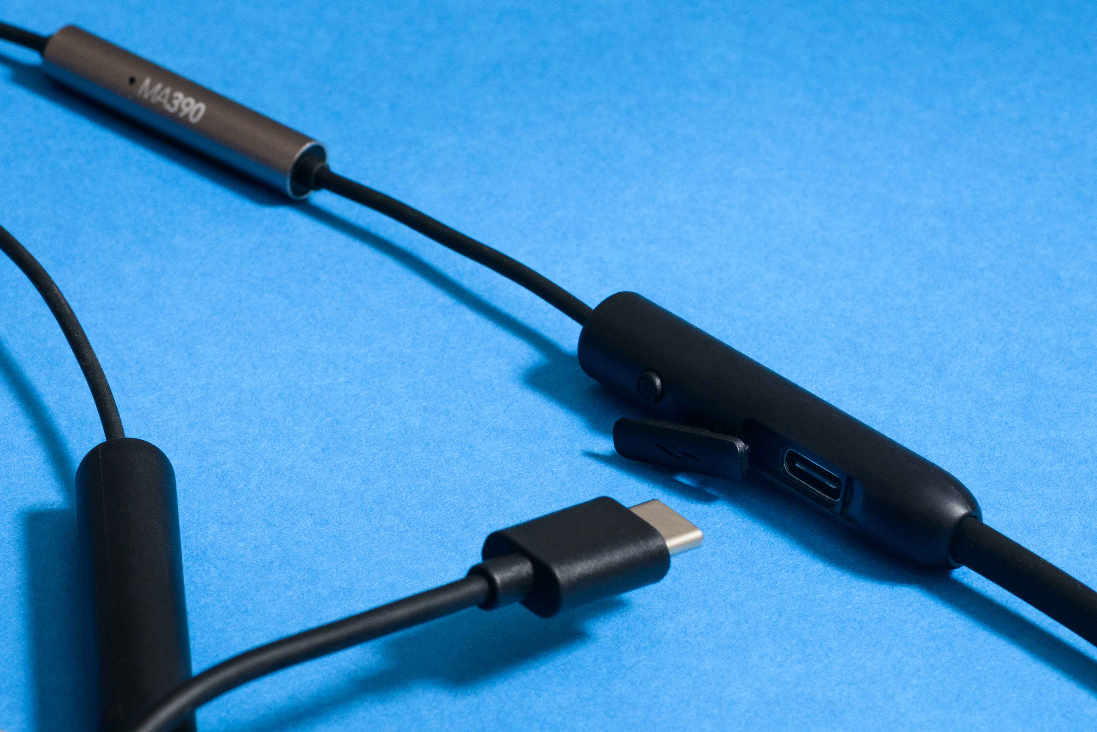 RHA MA390 Wireless announcement: A close-up of the USB-C input on a blue background.