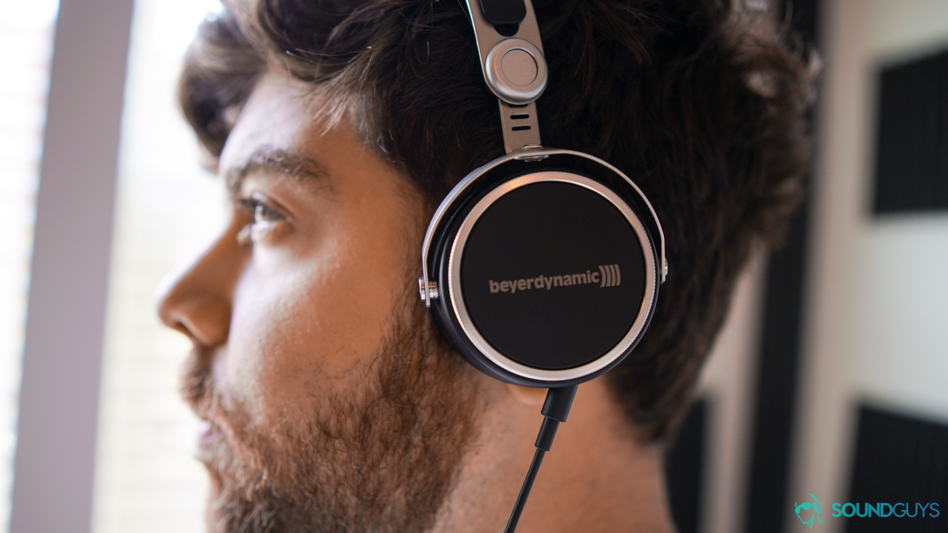 Best cheap soundbar: Wearing the Aventho Wired headphones.