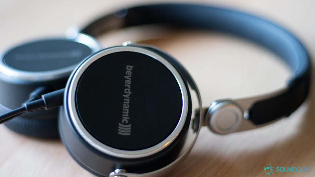 A close up of the headphones lying flat on a desk. 
