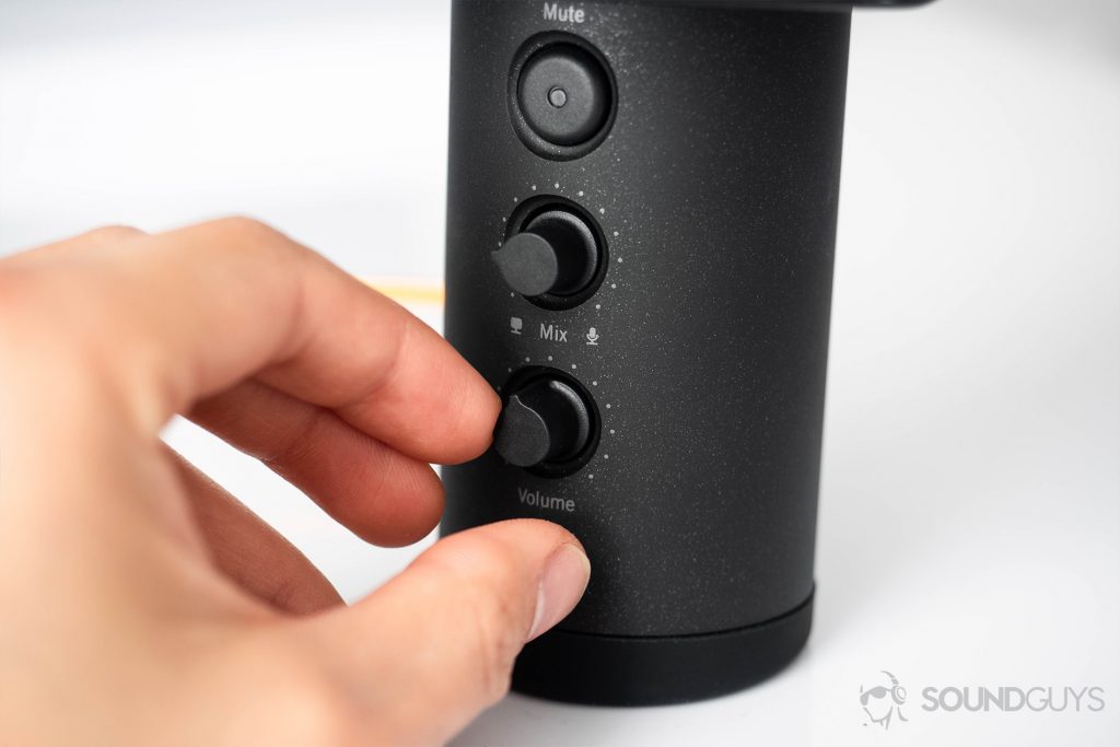 Beyerdynamic Fox USB microphone: A close-up of the knobs with the volume one being adjusted by hand - best gaming microphone