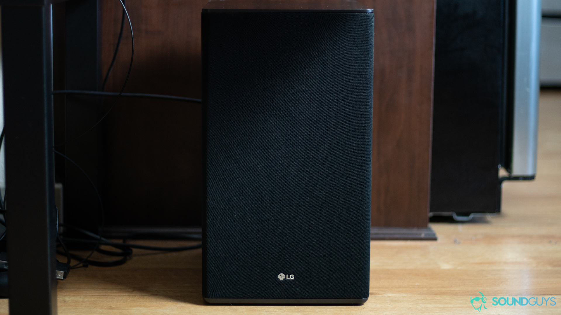 A picture of the LG SK10Y subwoofer on the floor.