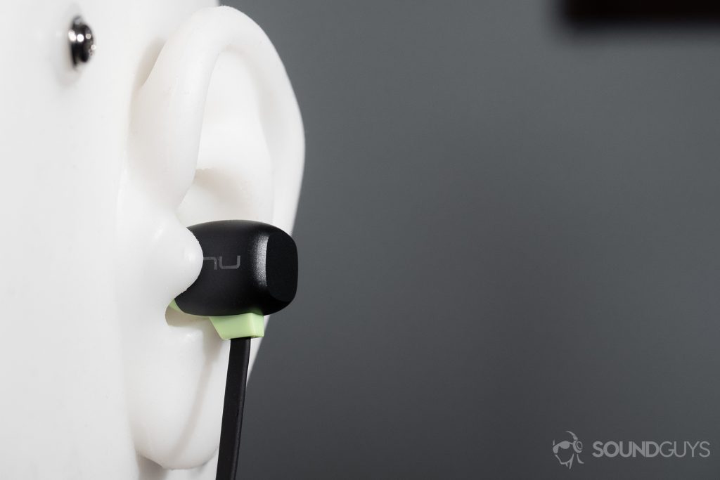 Optoma NuForce Be Sport4: The earbuds in a test head's ears.