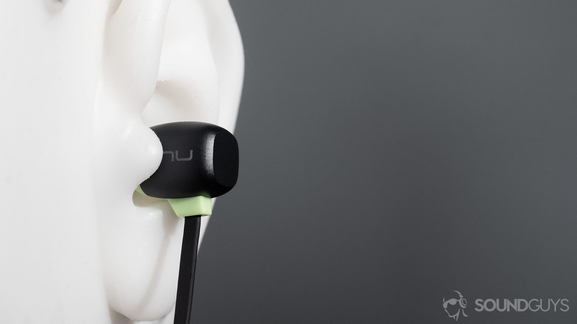 Optoma NuForce Be Sport4: The earbuds in a test head's ears.