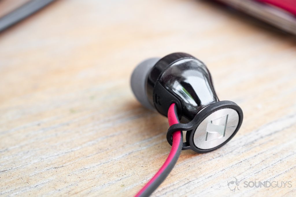 Sennheiser HD1 In-Ear Wireless: An earbud on a wooden surface.