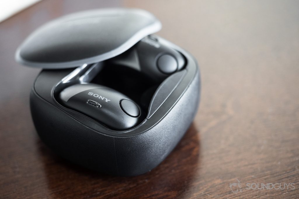 Sony WF-SP700N: The headphones seated in the case, angled away from the camera.