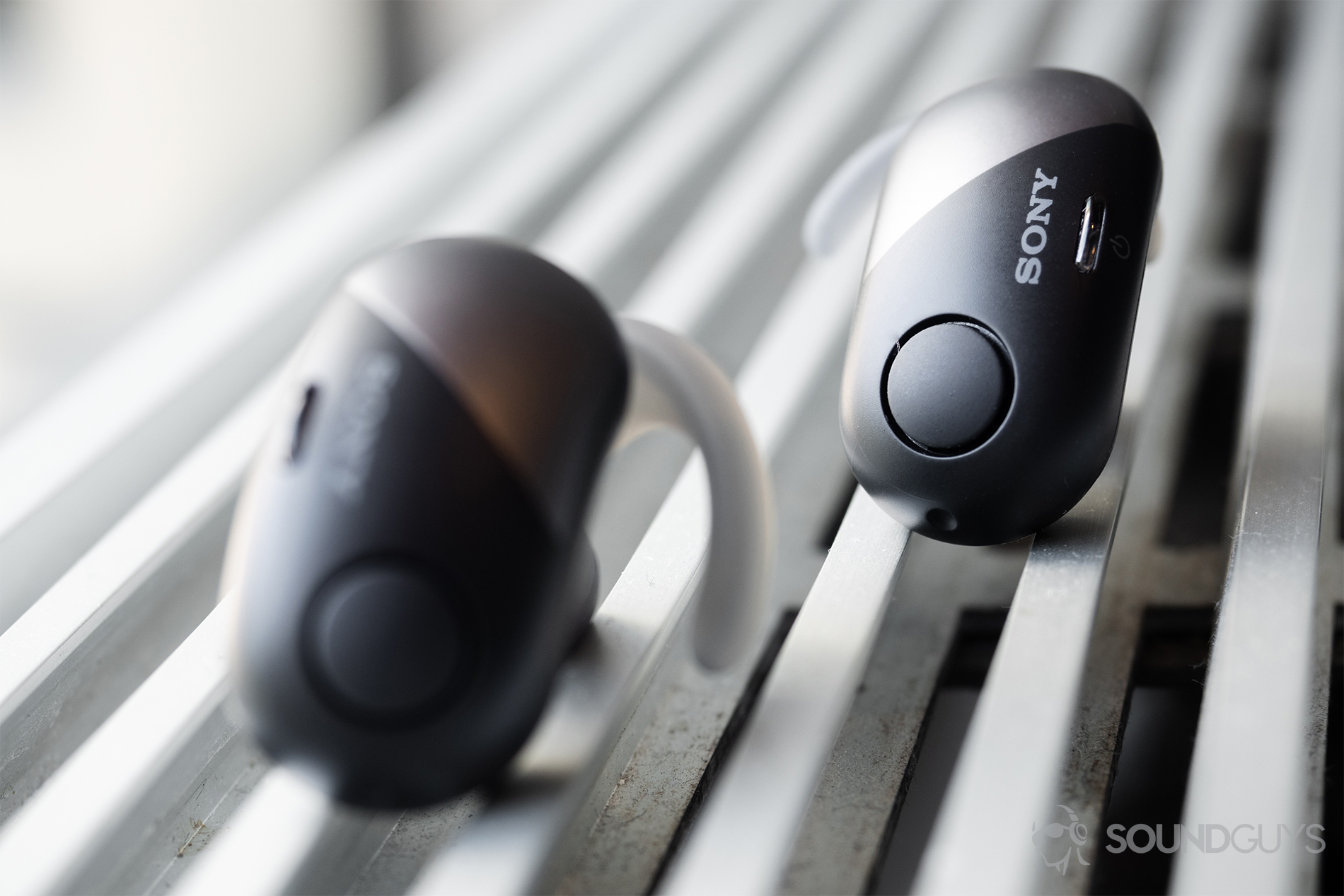 Sony WF-SP700N: The earbuds standing up on an air vent.