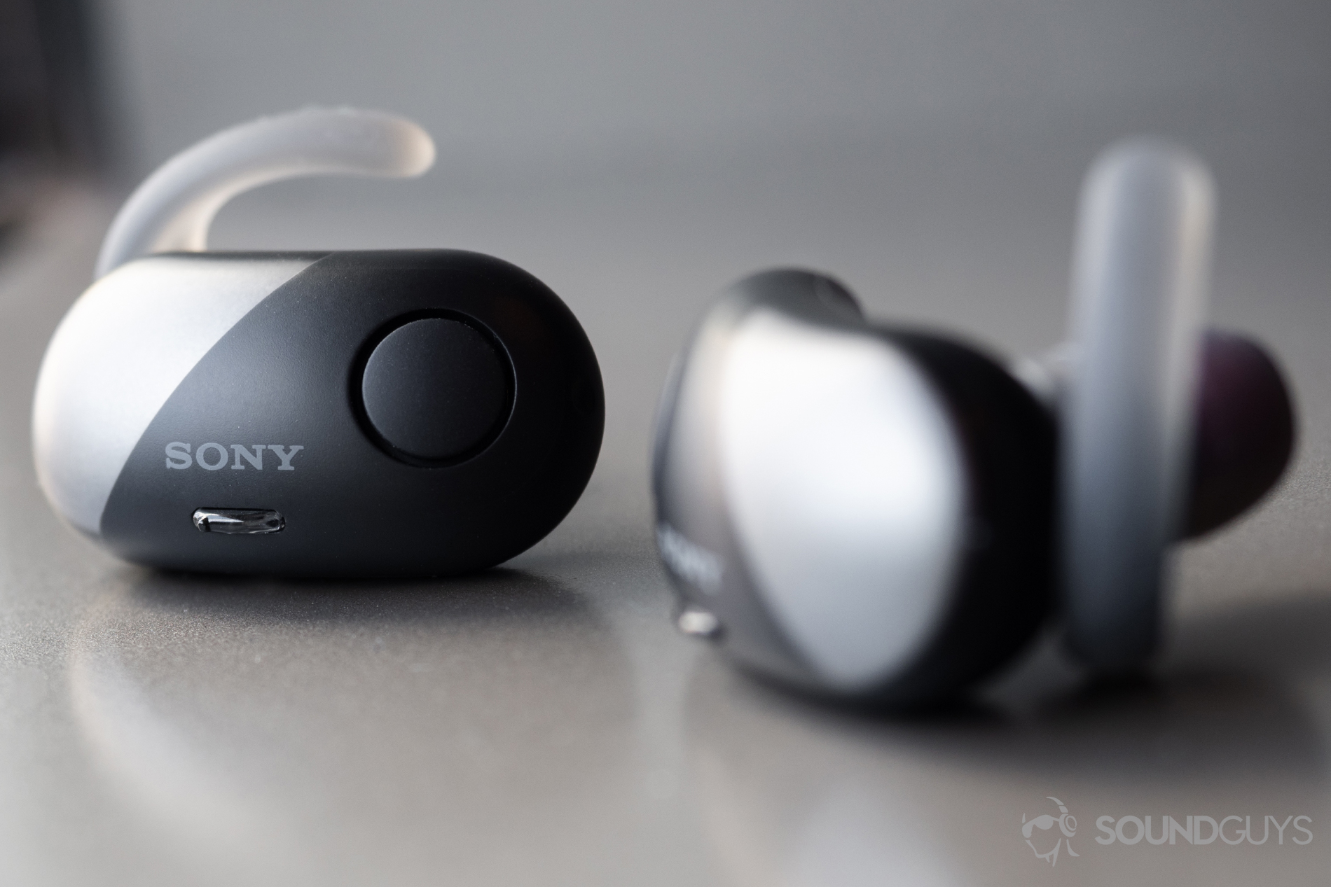 Sony WF-SP700N: A close-up of the earbuds with the background 'bud in focus.