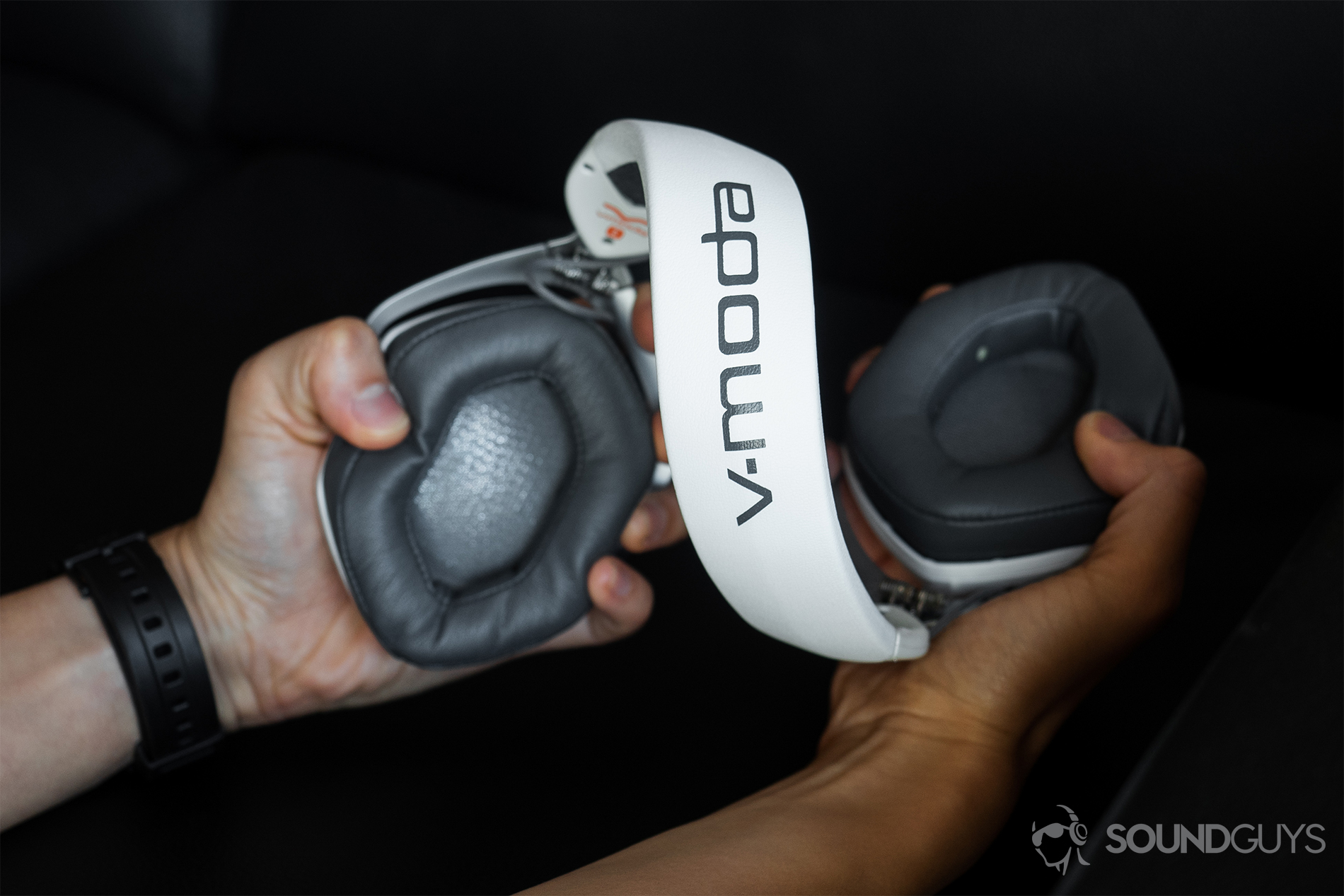 TheV-Moda Crossfade 2 Codex headphones being contorted in the hands.