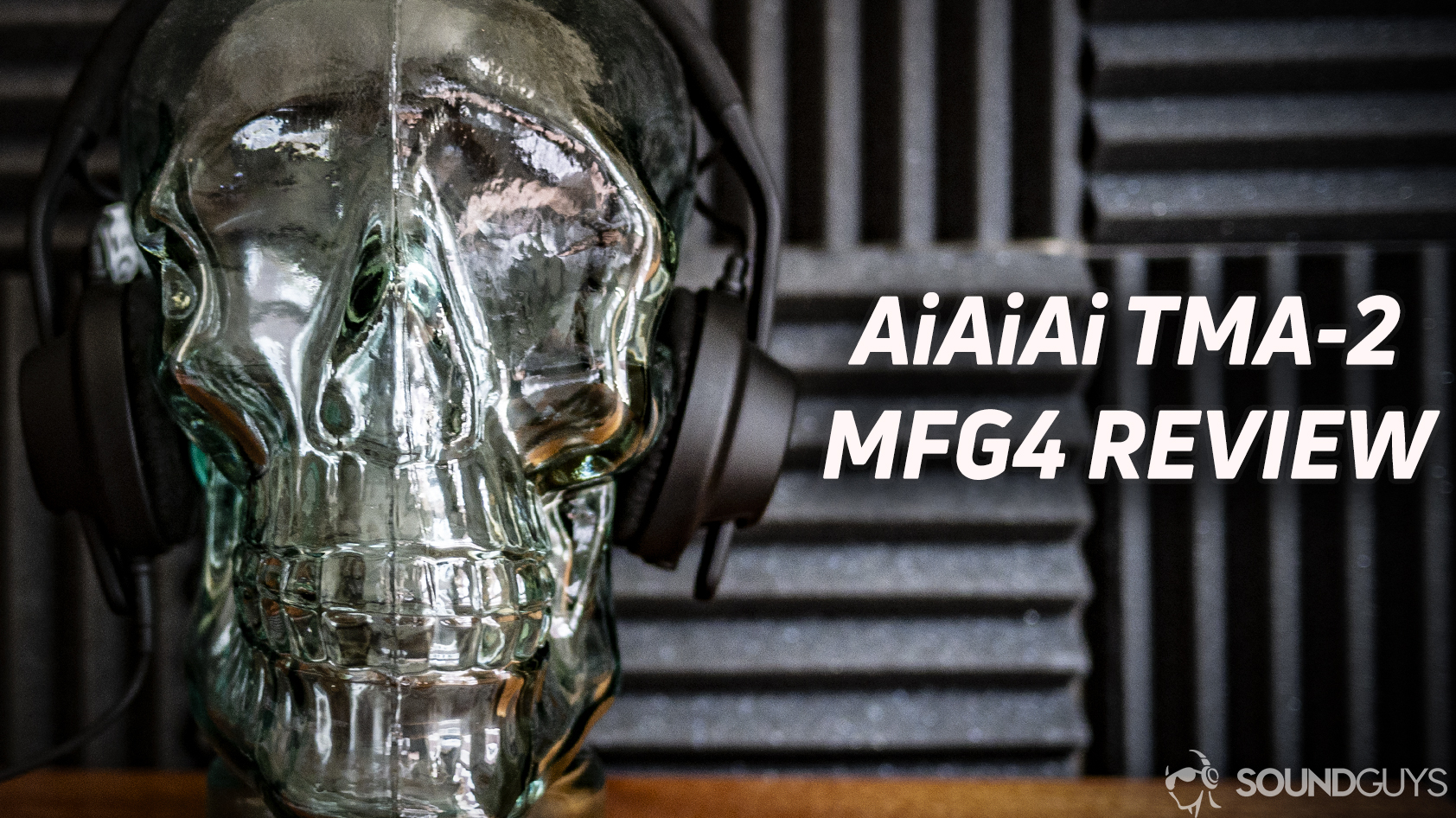A photo of the AiAiAi TMA-2 MFG4 headphones on a glass skull.
