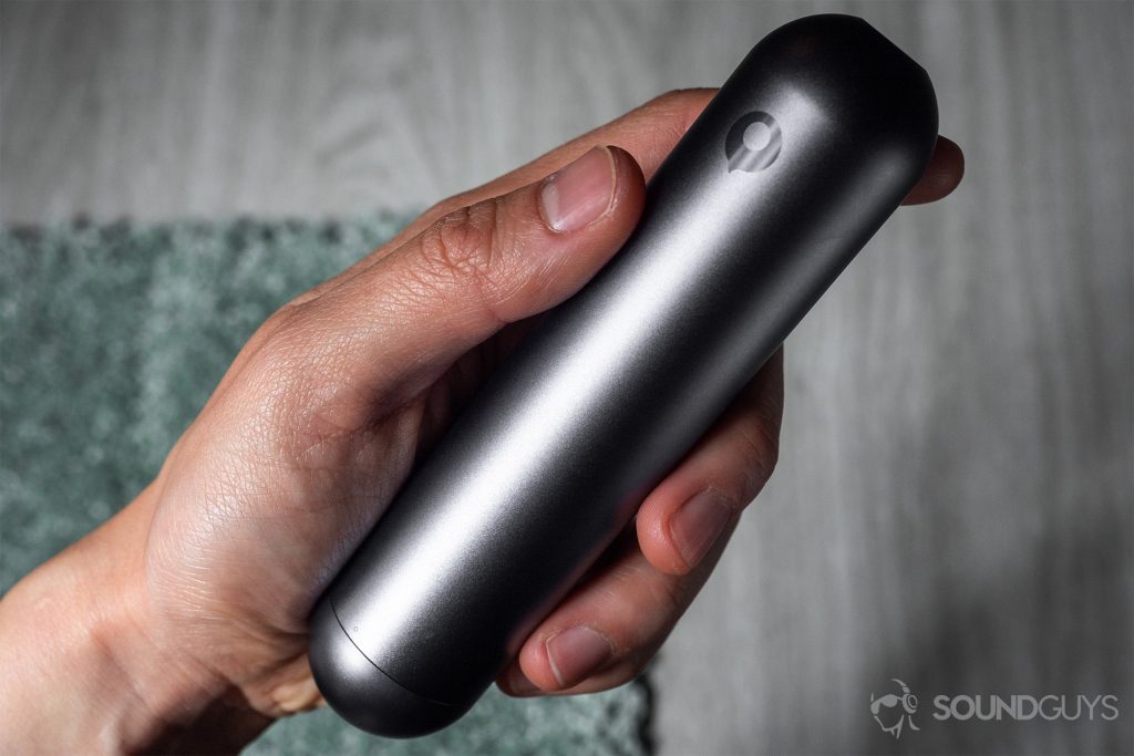 The charging case in the hand with the Crazybaby logo facing the camera.