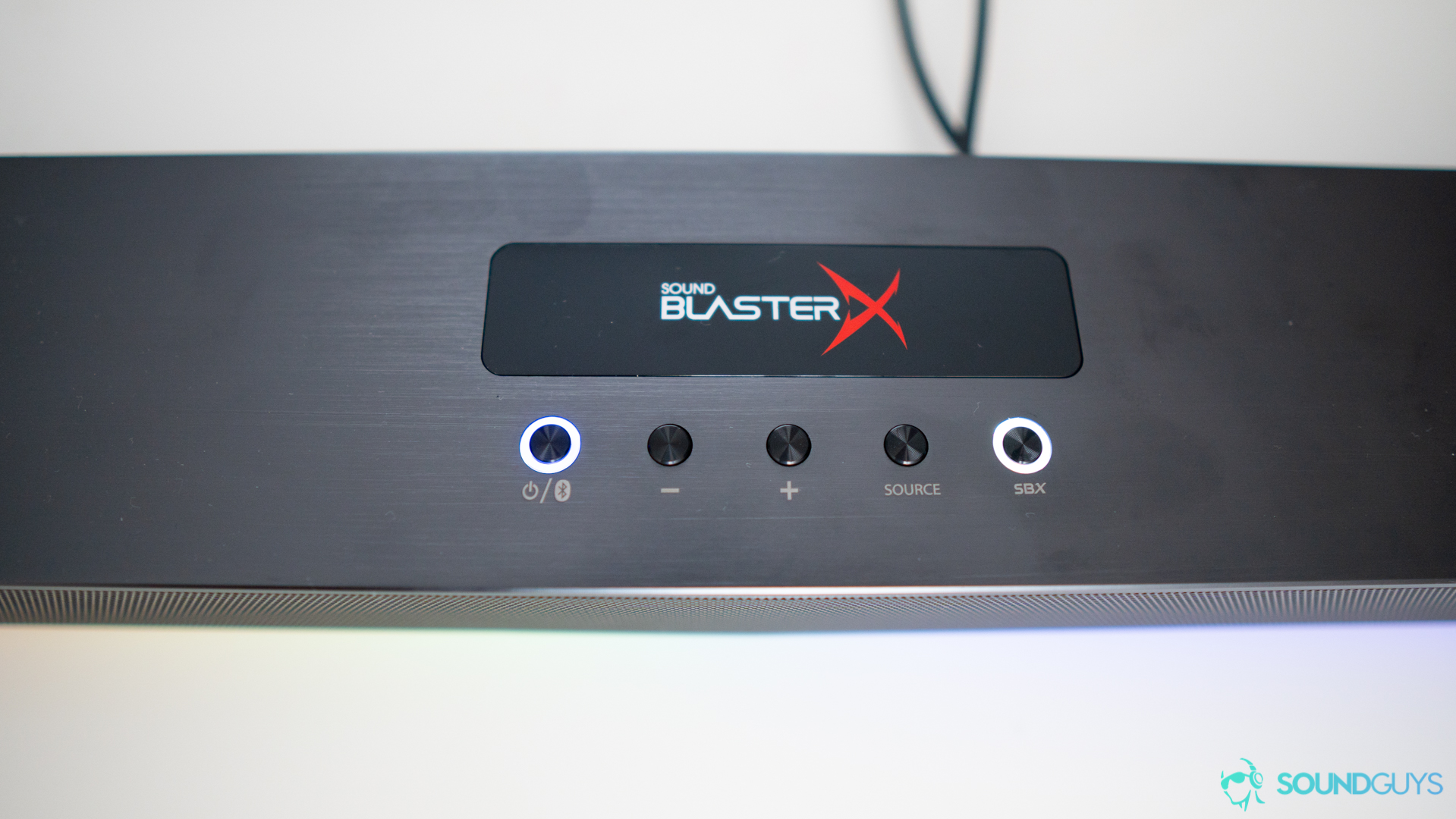 Pictured are the buttons of the Creative Sound BlasterX Katana for power, volume, and more.