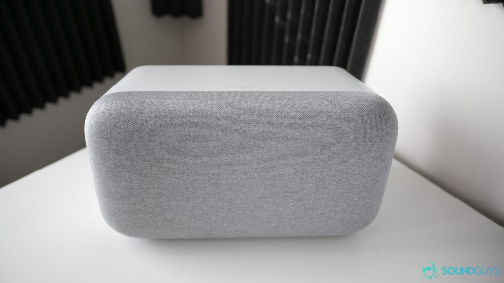 Google Home Max in white pictured on a white desk. 