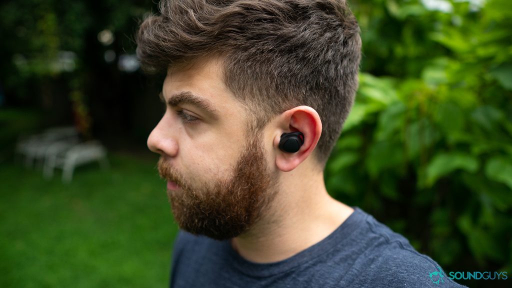 best true wireless earbuds under $100 - Wearing the Samsung Gear IconX to show how they look in the ear.