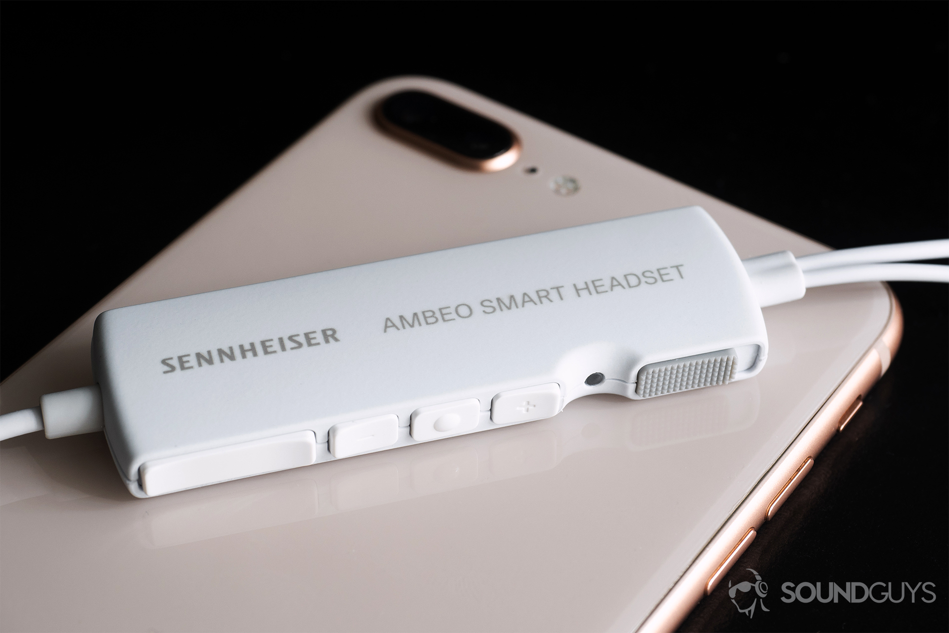 Sennheiser_Ambeo-1 Sennheiser Ambeo Headset: A slightly angled image showing off the control module and all of its toggles. It rests on an iPhone 8 Plus.