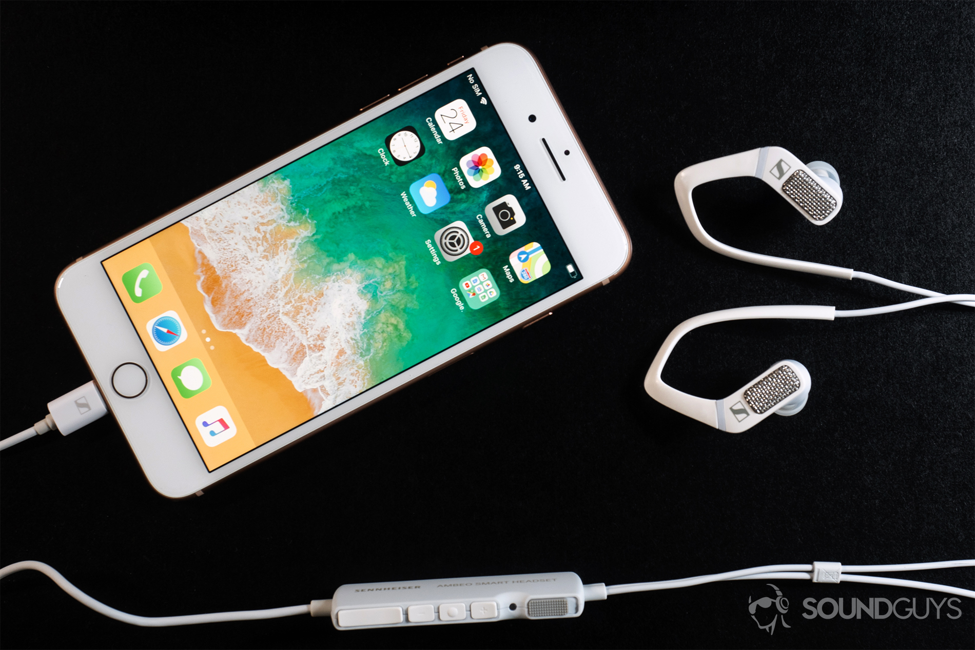 Sennheiser_Ambeo-2 Sennheiser Ambeo Headset: Overhead shot of the iPhone 8 Plus in rose gold with the headset with both earbuds and the control module in frame.