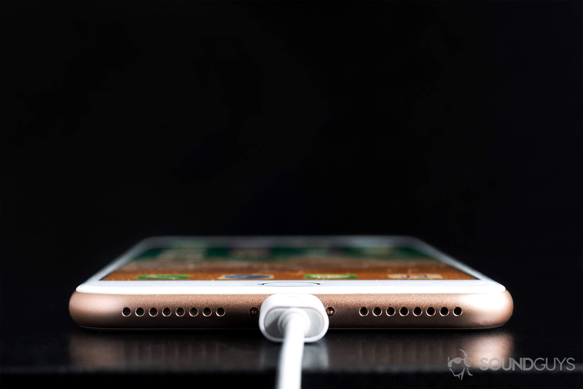 Sennheiser_Ambeo-3 Sennheiser Ambeo Headset: Straight-on shot of the headset plugged into an iPhone 8 Plus.