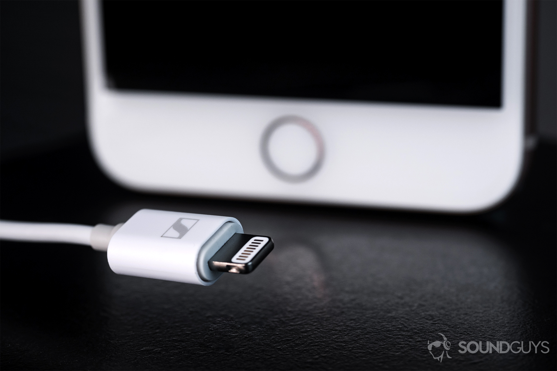 Sennheiser_Ambeo-7 Sennheiser Ambeo Headset: A close-up of the Lightning connector with an iPhone 8 Plus in the background.