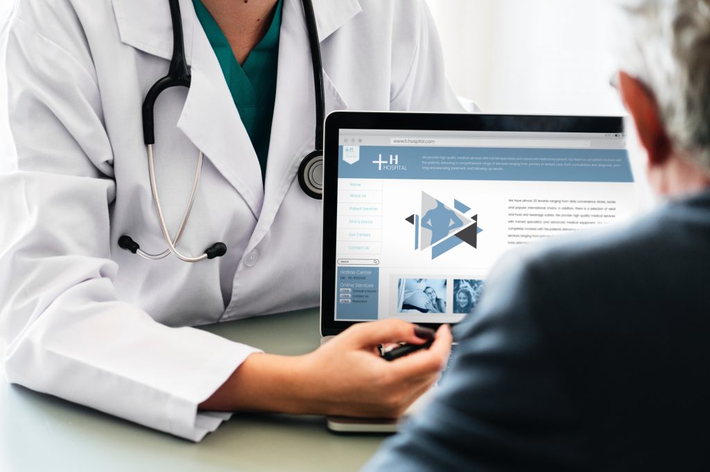 A photo of a doctor with a tablet computer.