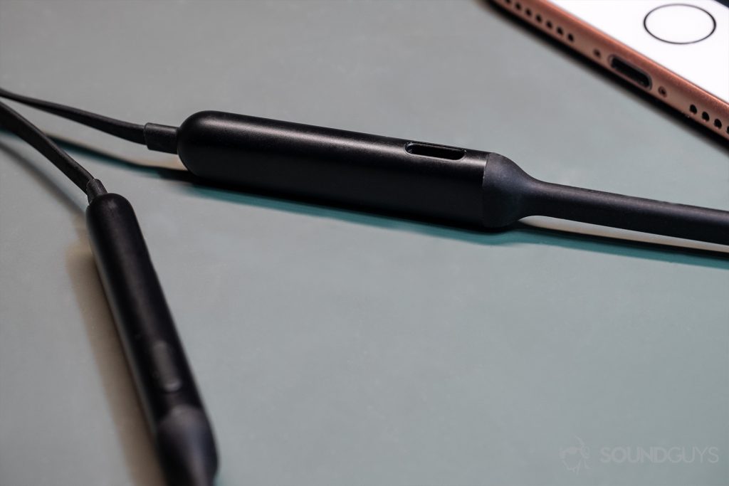 A photo of the BeatsX neckband where the Lightning charging port is located.
