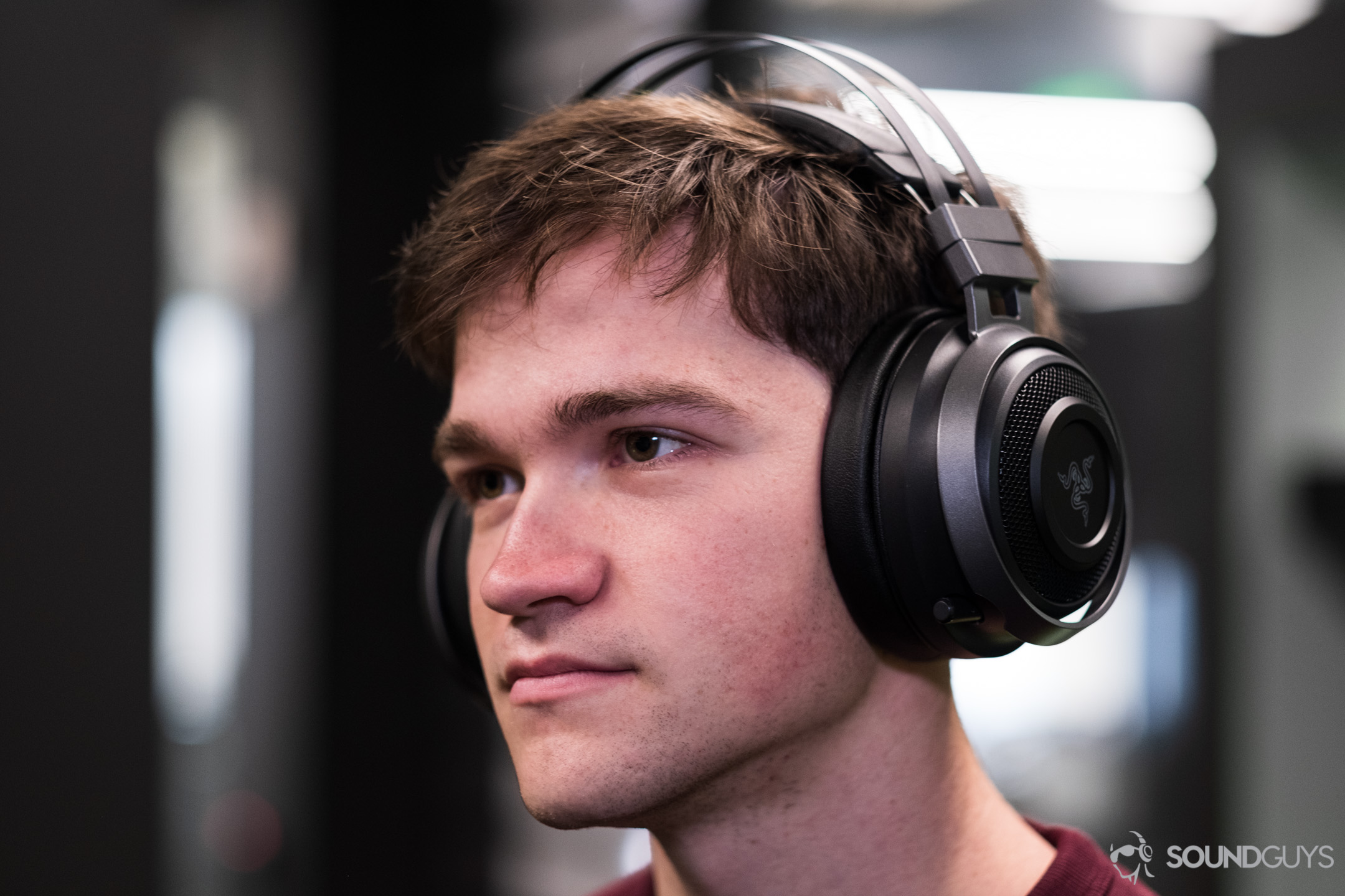 A picture of a man wearing the Razer Nari Ultimate wireless gaming headphones.