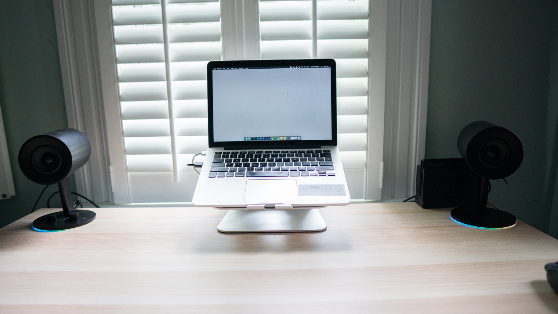 The Razer Nomma Chroma speakers pictured on a desk.