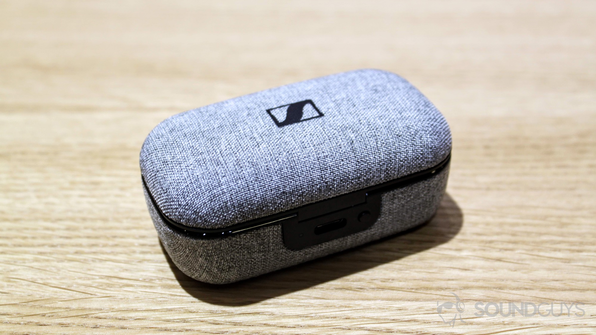 android-authority-sennheiser-momentum-true-wireles-2 Sennheiser Momentum True Wireless earbuds case on a table.