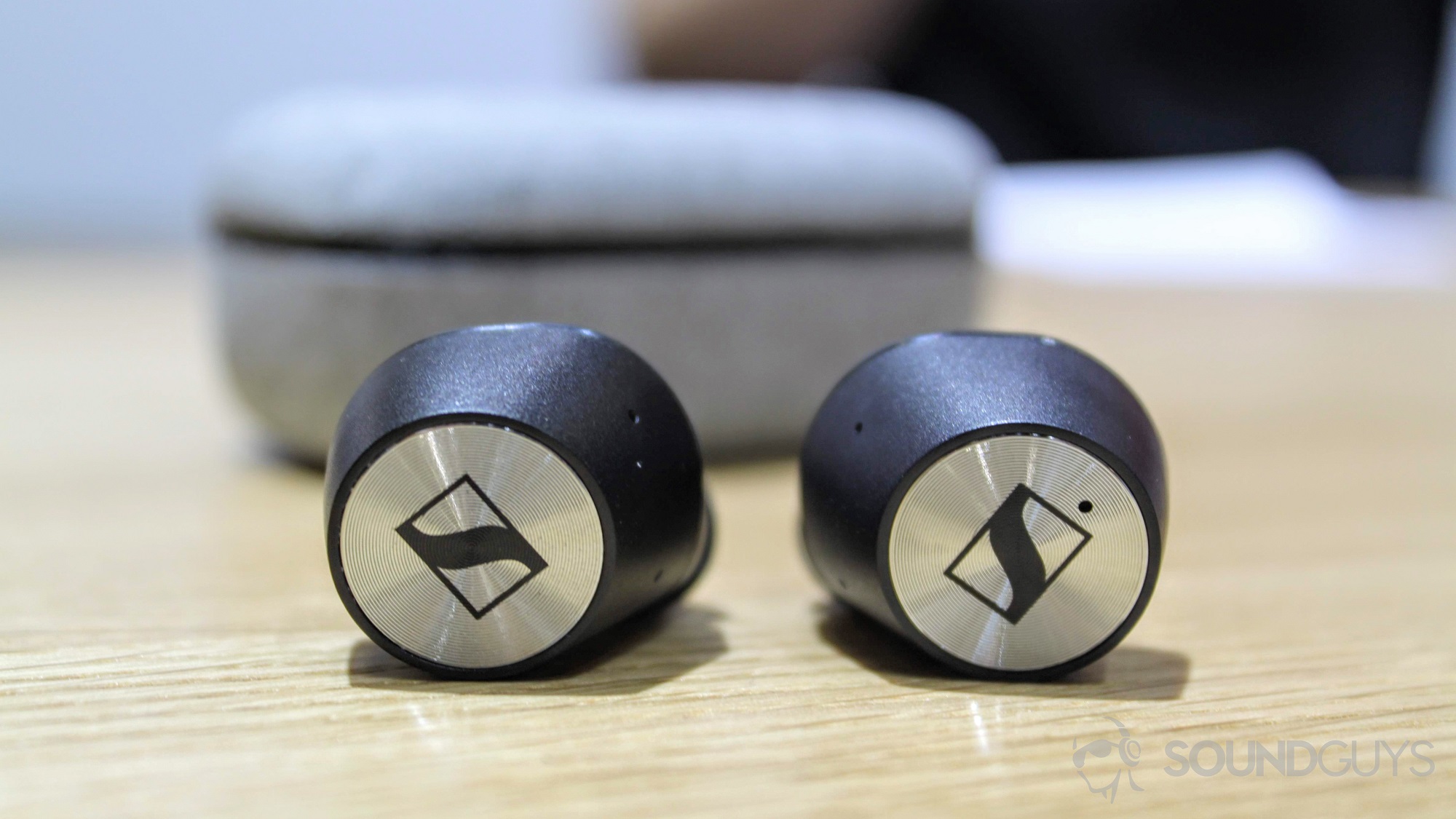 android-authority-sennheiser-momentum-true-wireles-3 Sennheiser Momentum True Wireless earbuds on a table.