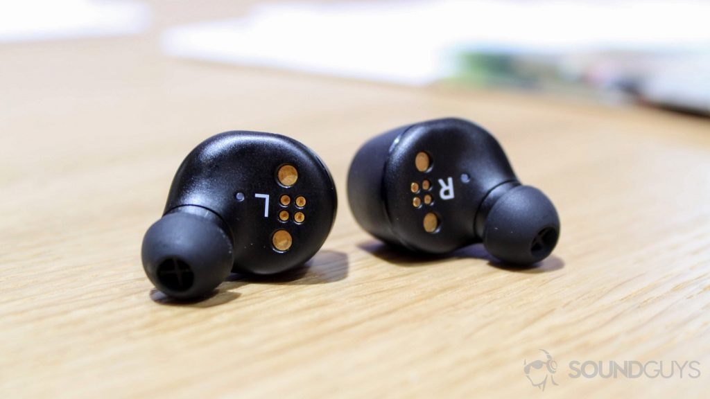 Sennheiser Momentum True Wireless earbuds on a table.