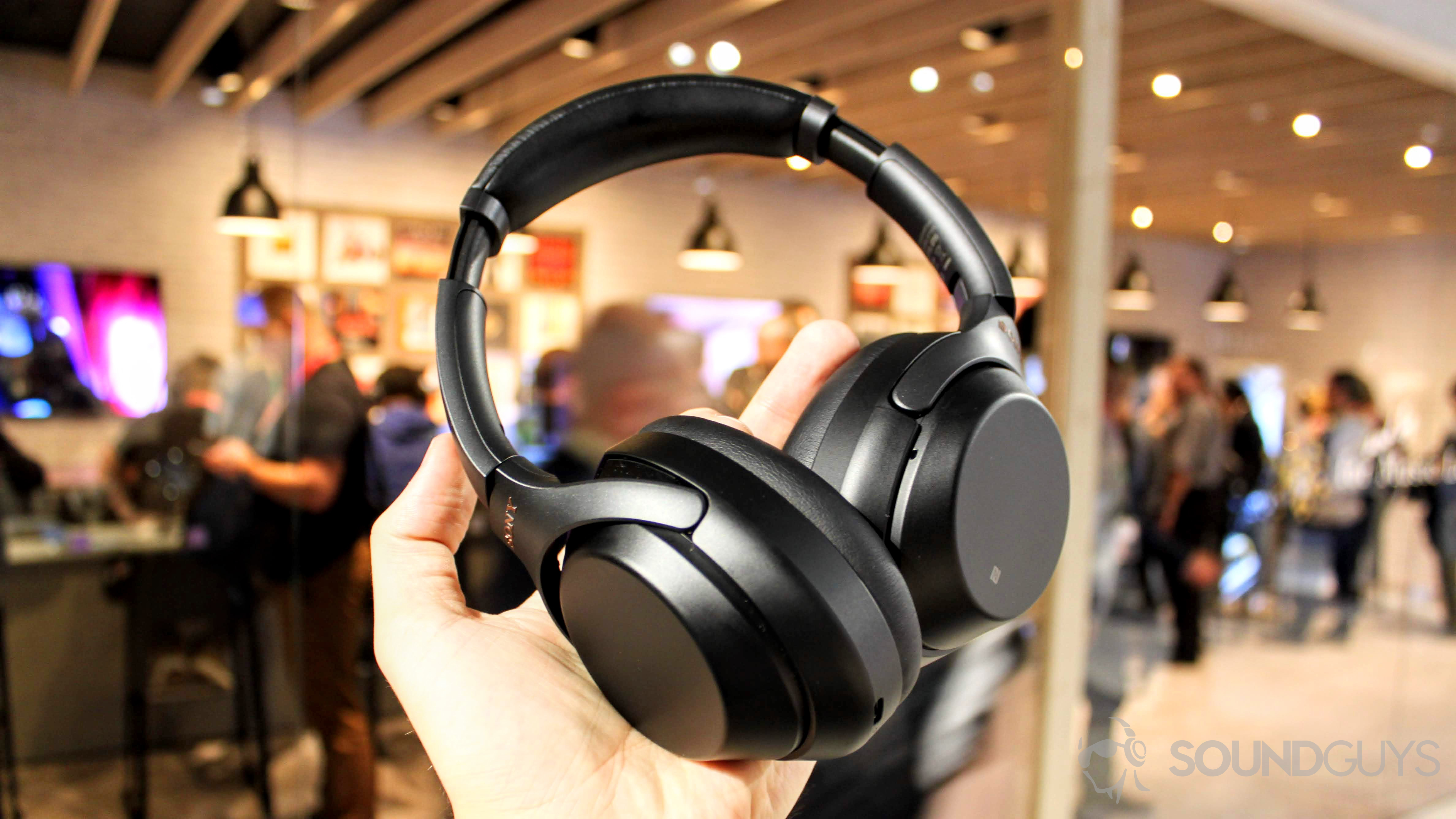 Sony WH-1000X M3 headphones in a hand.
