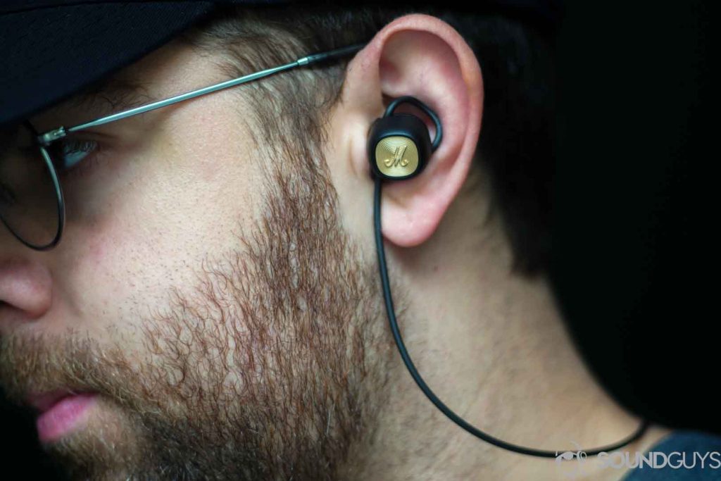 Best Bluetooth speakers: Picture of Adam wearing the Marshall Minor II earbuds.