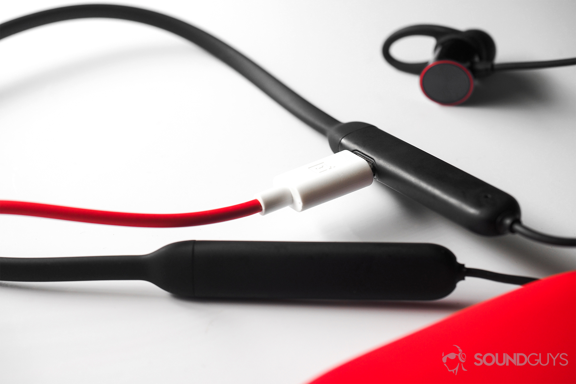 A picture of the OnePlus Bullets Wireless' USB-C cable inserted into the neckbud input.