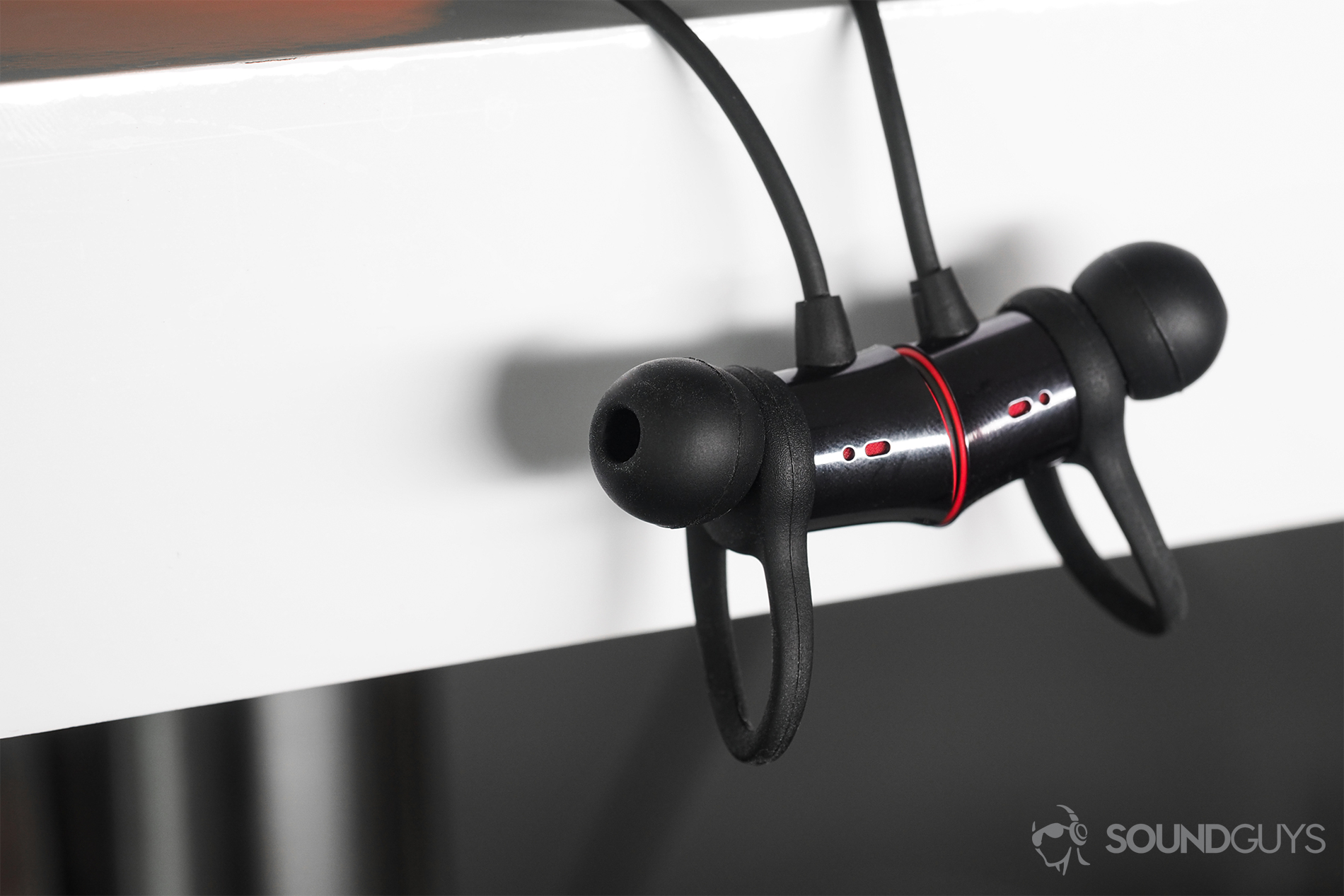 An image of the OnePlus Bullets Wireless earbud housings magnetized together.
