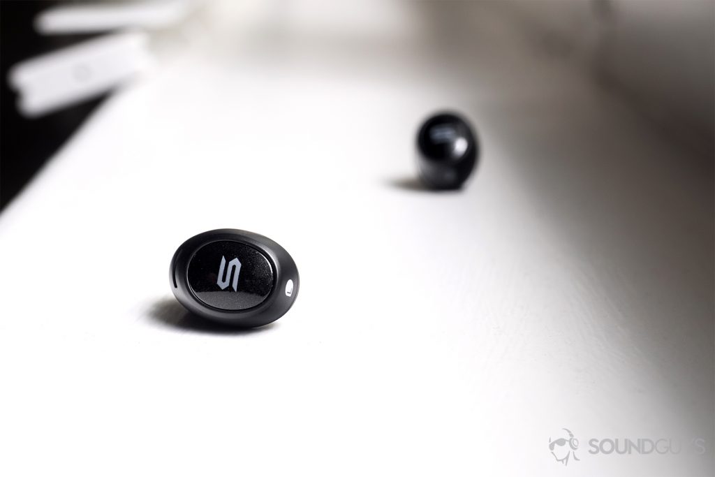 Soul Emotion: Straight shot of the earbuds on a windowsill with the "S" Soul logo facing the camera.