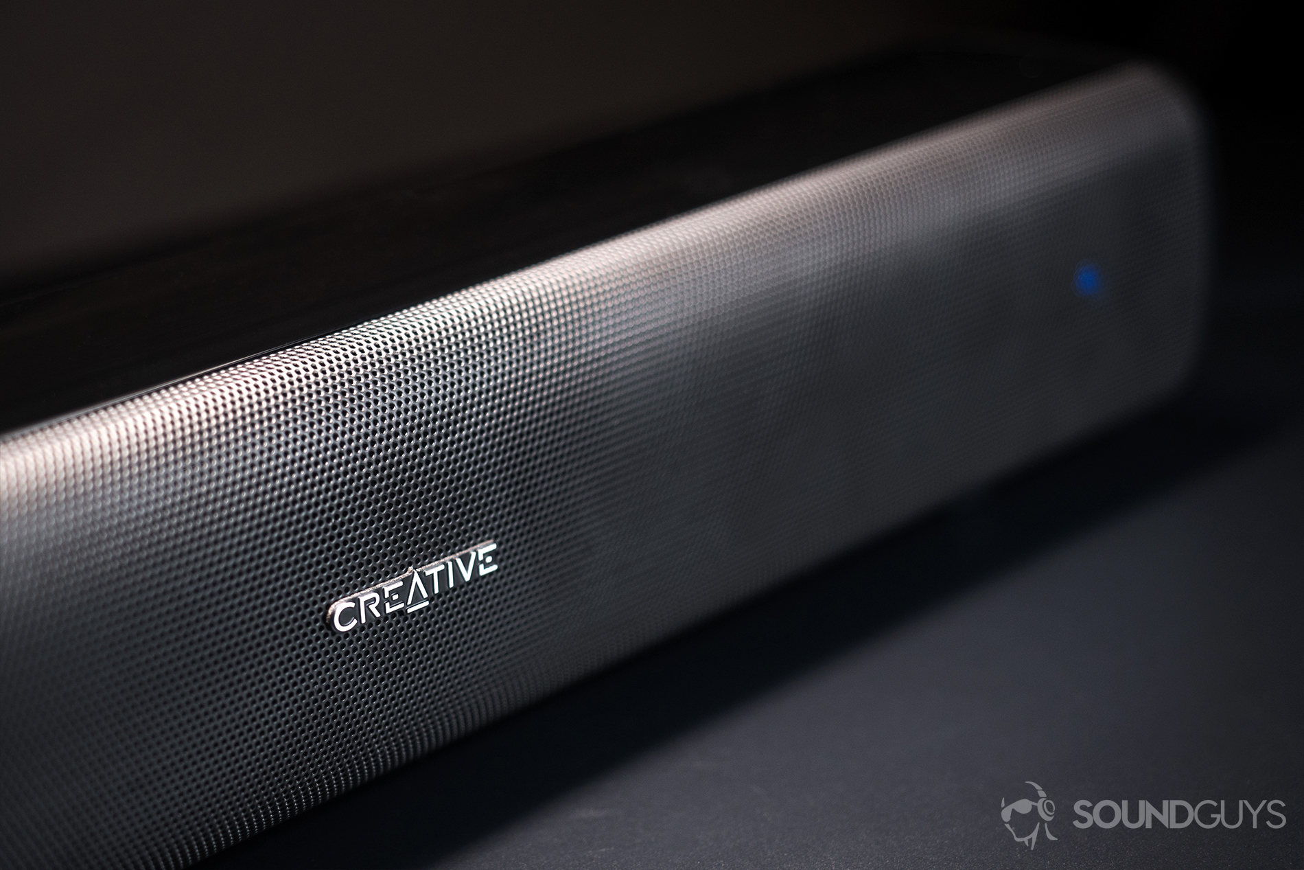 Creative Stage Air: The Creative brand name on the speaker grill.