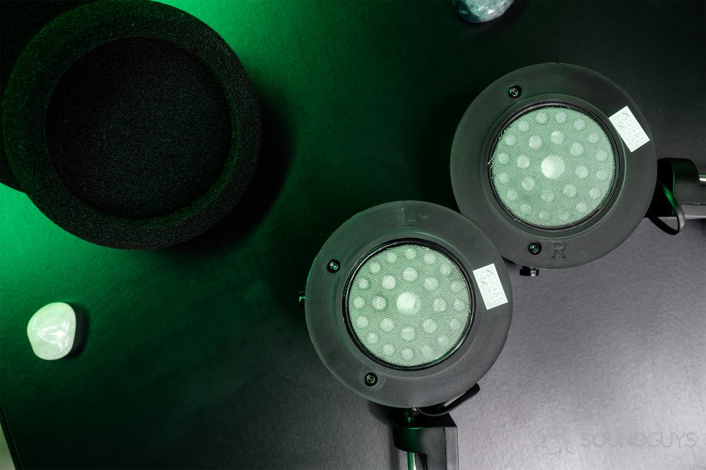 Grado GW100: Top-down image of the ear cups unsheathed with the ear pads off to the side on the upper left hand corner.