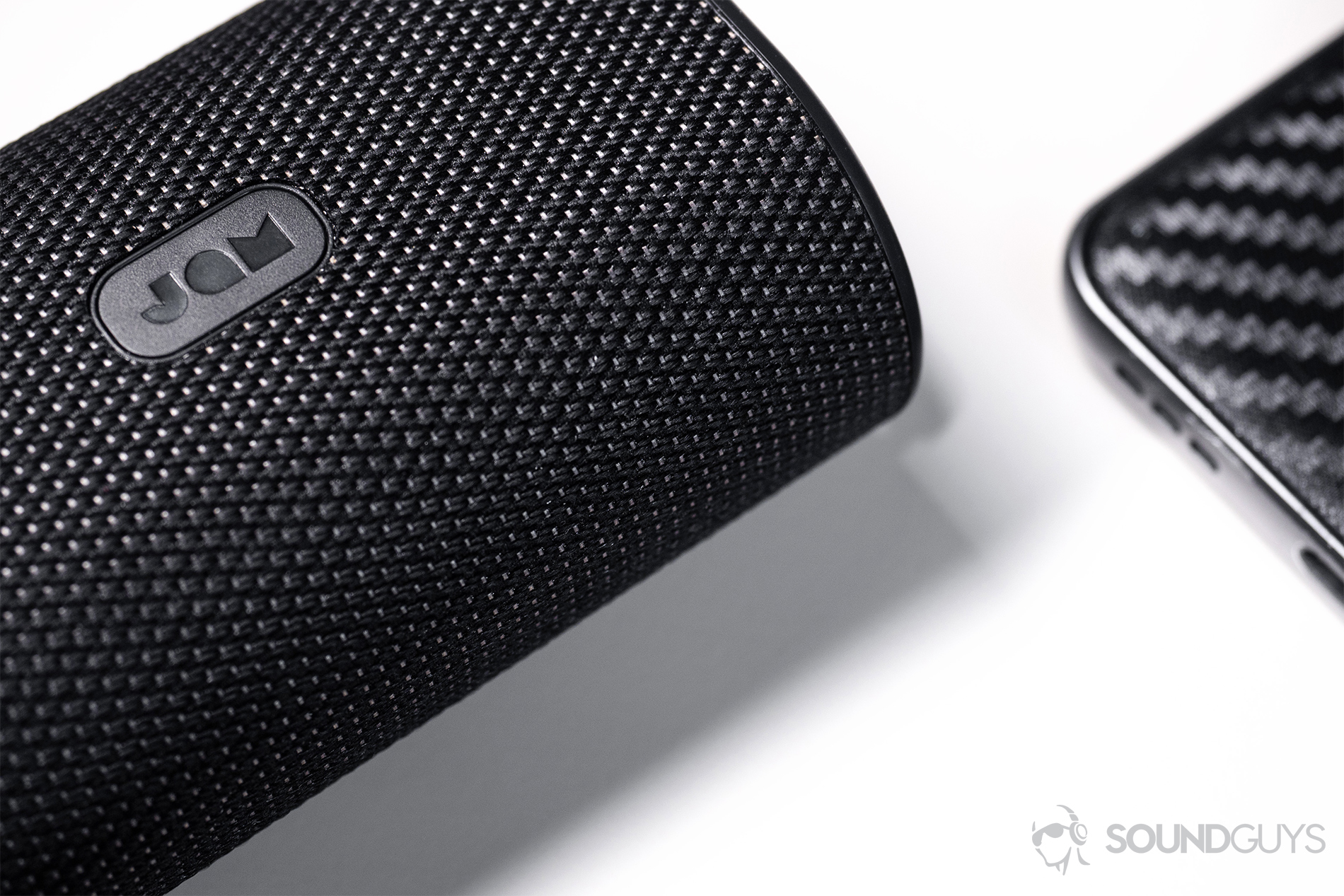 Jam Live True: A close-up of the clothe-wrapped charging case.