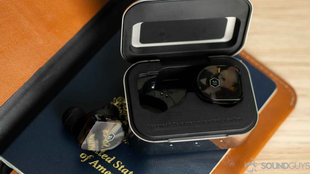 The MW07 earbuds sin the open charging case. 