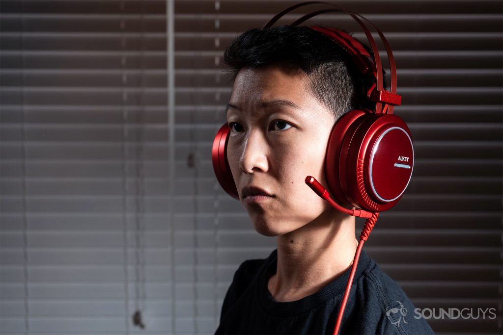 Aukey 7.1 Gaming Headset: A woman wearing the headset in read.