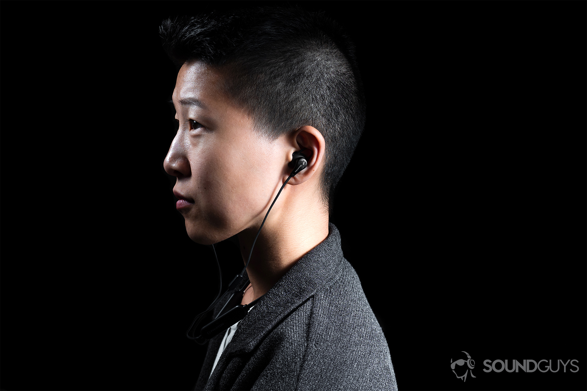 Phiaton Curve BT 120 NC: The profile of a woman wearing the earbuds.