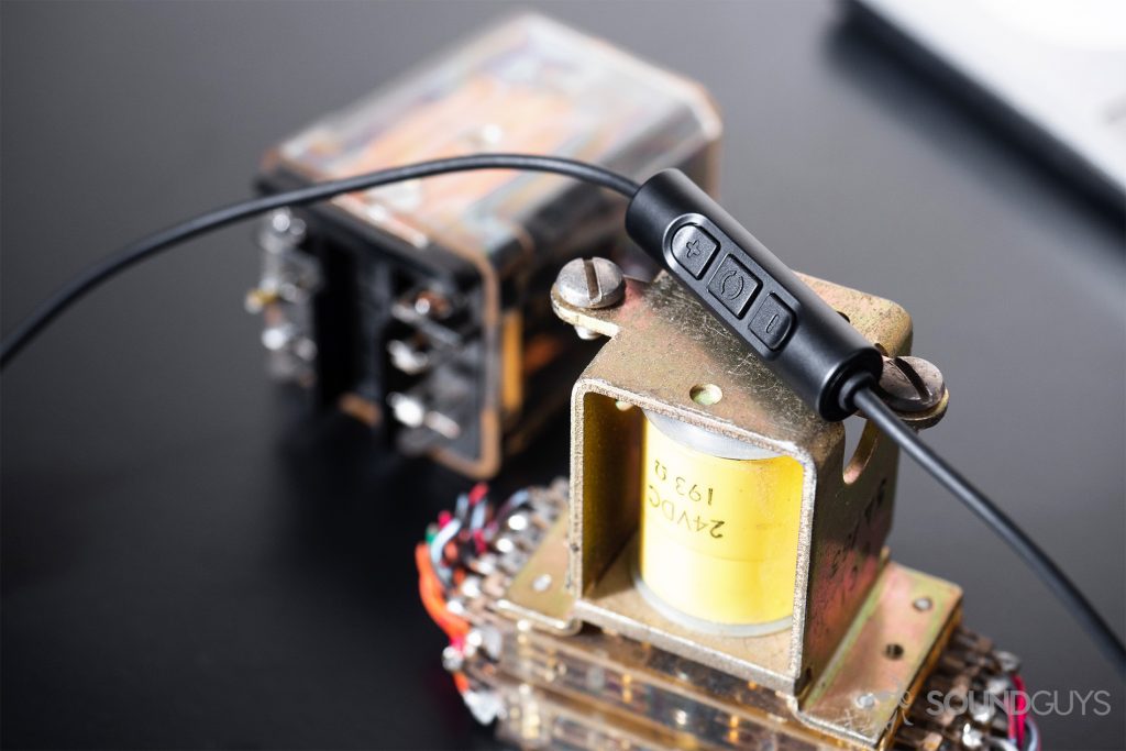 The Beyerdynamic Soul Byrd integrated mic and remote module atop a copper electronic part.